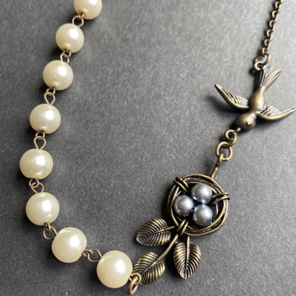 Plunder Design bronze toned necklace with bird, nest and eggs and pearl accents